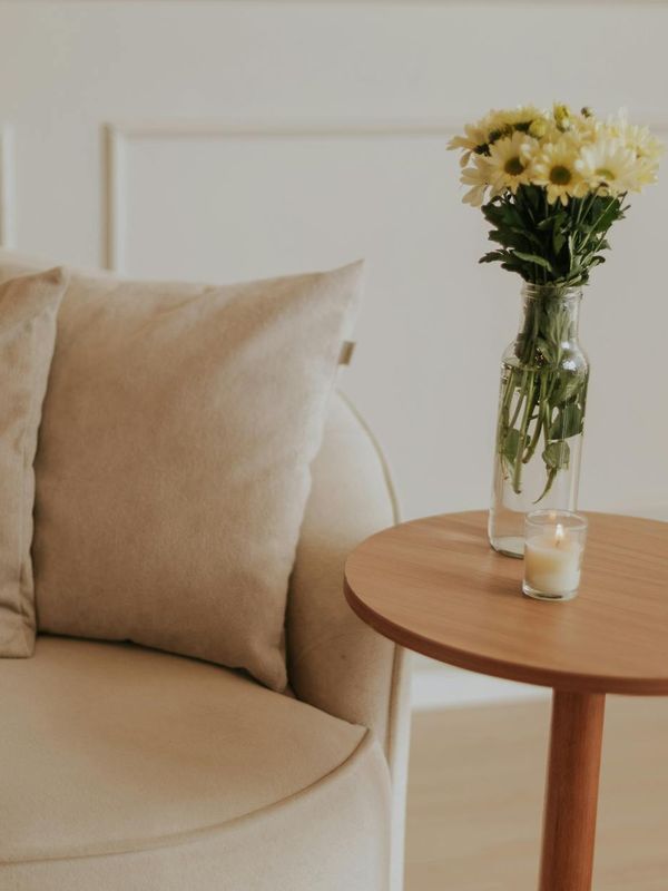 Person meditating in a calm, minimalist room with soft morning light.